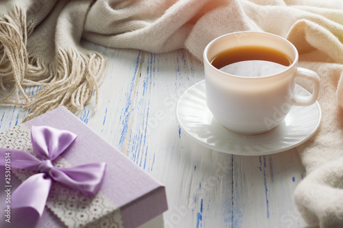 Cup with Coffee, Gift on the White Wooden Table. Concept of Spring