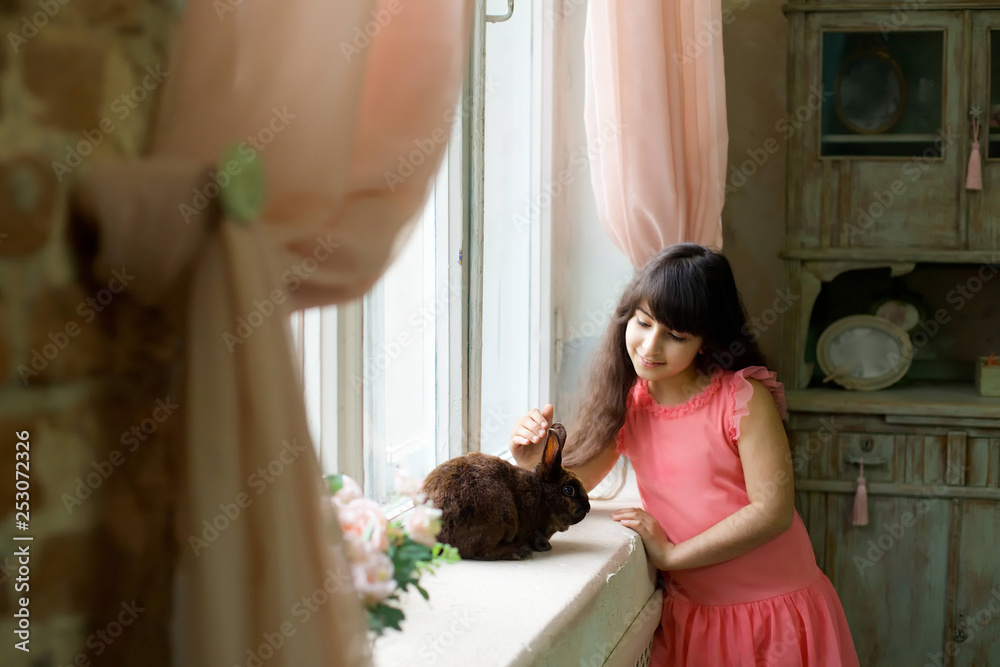 Fototapeta premium Beautiful girl with a Easter Bunny.