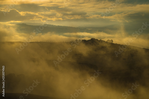 Wonderful, fabulous and misty sunrise in Tuscany
