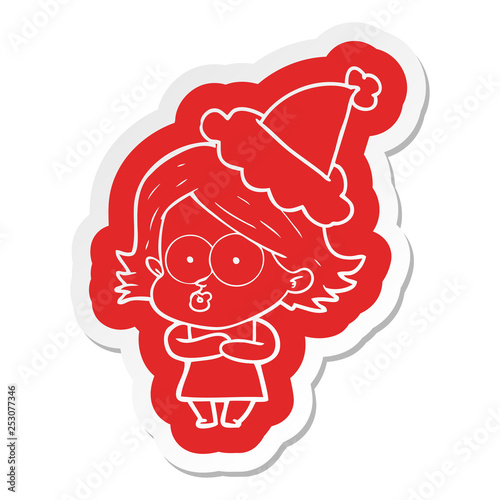 cartoon  sticker of a girl pouting wearing santa hat