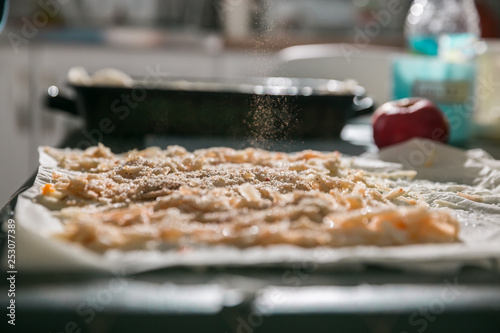 Preparation of pumpkin and apple pie with phyllo crust.