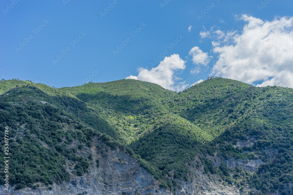 Italy, Cinque Terre, Monterosso, a large mountain in the background