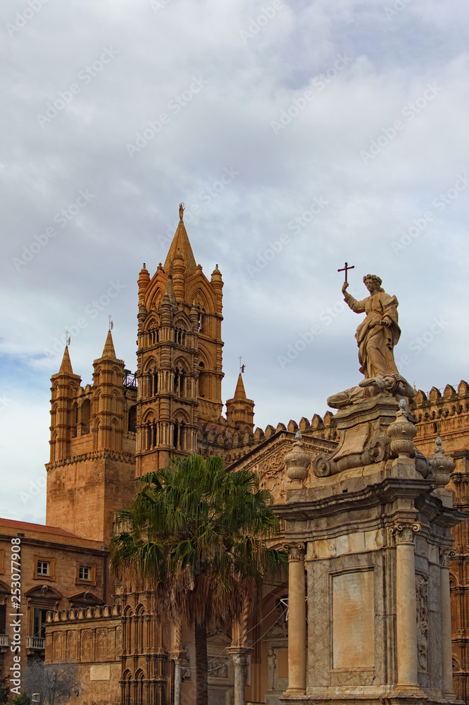Sculpture in front of Palermo Cathedral. Medieval Cathedral built in Arab-Norman architectural style. Travel and tourism concept. Palermo, Sicily, Italy