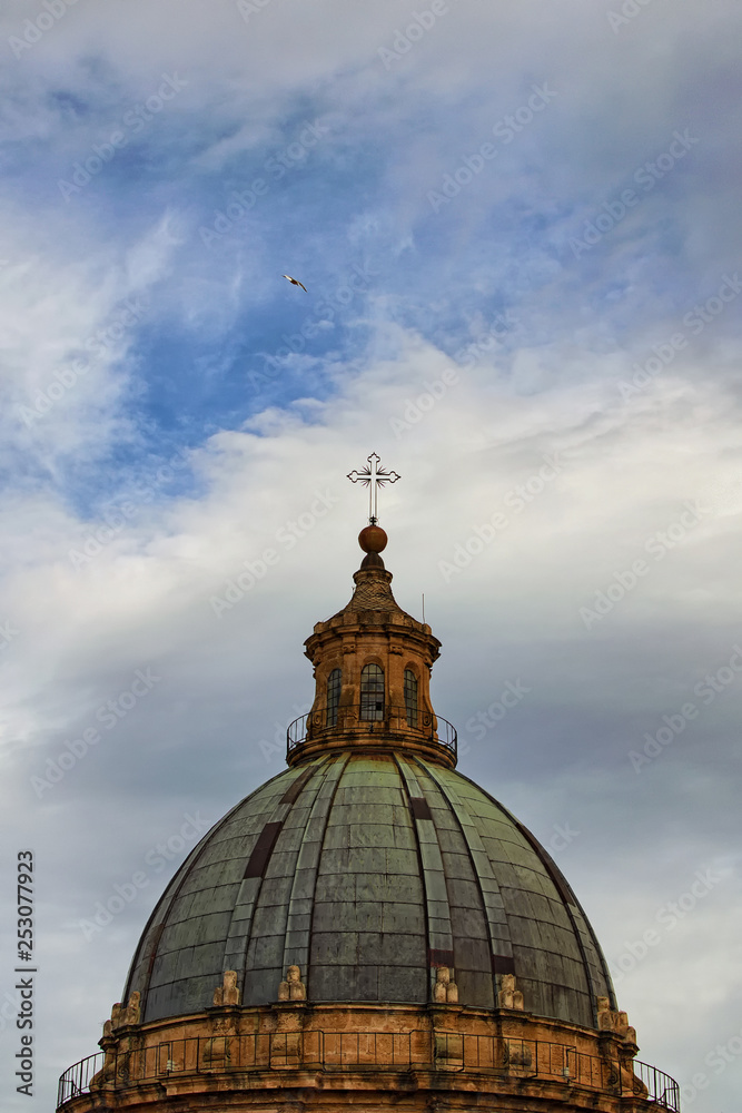Scenic view from rooftop to the dome of medieval Palermo Cathedral. The church was erected in 1185 by Walter Ophamil, the Anglo-Norman archbishop of Palermo. Travel and tourism concept. Sicily, Italy