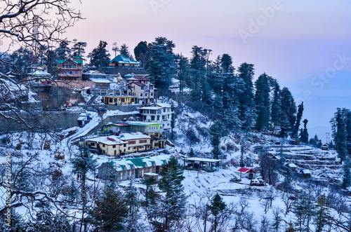 View of Kufri village 15 Kms above Shimla, Himachal Pradesh, India at sunset. It is a popular winter getaway where people come to enjoy snowfall, skiing and winter sports. 