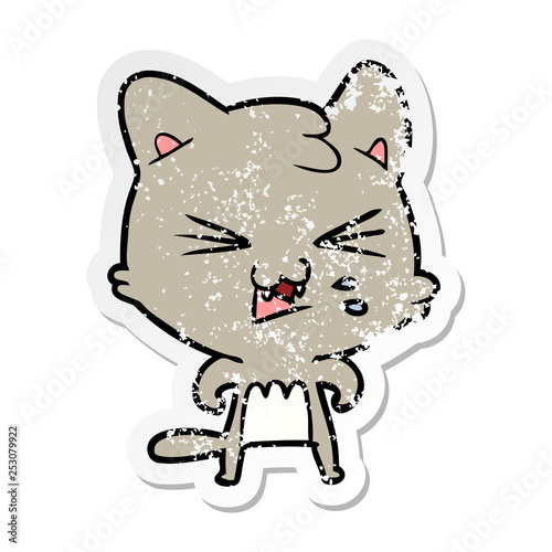 distressed sticker of a cartoon hissing cat