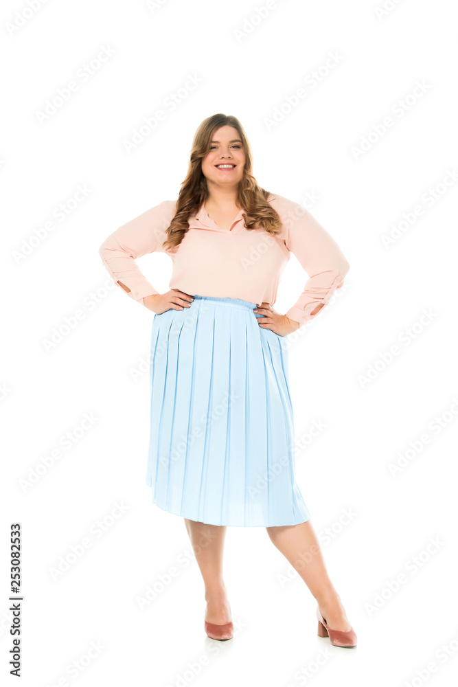 smiling happy overweight woman in elegant clothing posing with hands on hips isolated on white smiling happy overweight woman in elegant clothing posing with hands on hips isolated on white