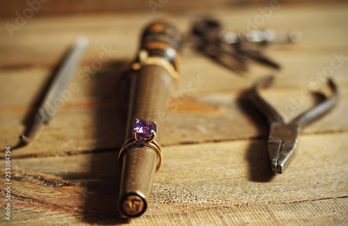 Amethyst ring and jeweler tools