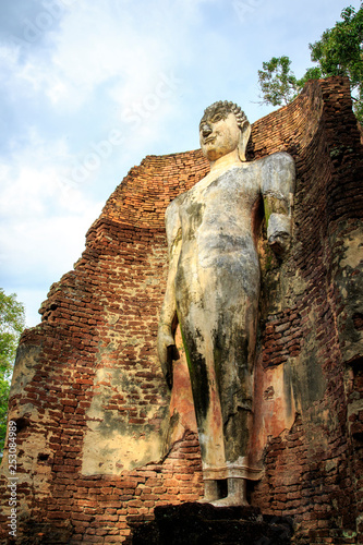 Big Buddha statue at the ruins in Kamphaeng Phet Historical Park In Thailand, Buddha statue, Old Town,Tourism, World Heritage Site, Civilization,UNESCO. photo