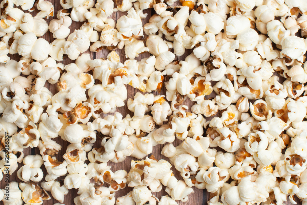 Fresh made Popcorn on an old and rustic wooden table Fresh made Popcorn on an old and rustic wooden table