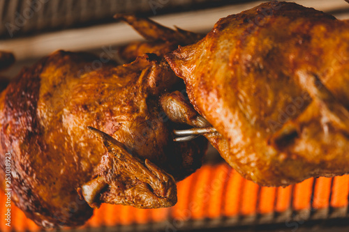 Roasted chicken on rotisserie 