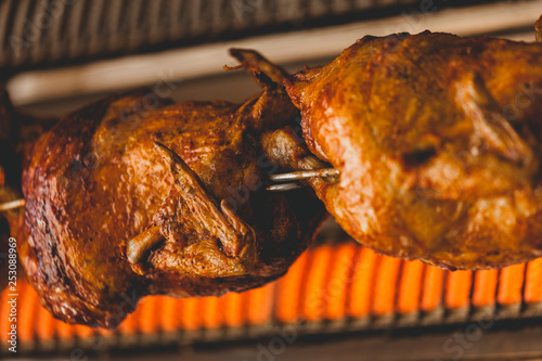 Roasted chicken on rotisserie 