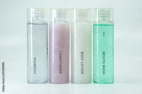 Hotel toiletry, shampoo, conditioner, body lotion and mouth wash.