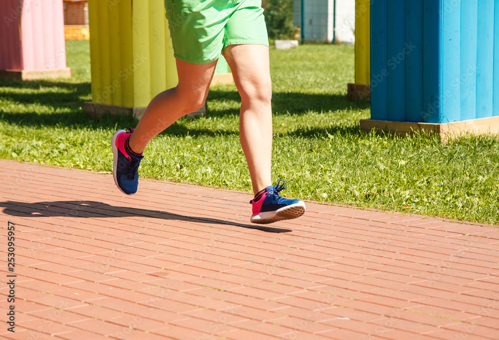 legs of girl running in a sports competition