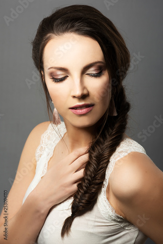 portrait of beautiful girl with fine makeup and fish braid