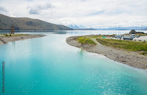 Beautiful view of turquoise water of lake Tekapo in New Zealand one of the most tourist attraction place in South island. Church of the Good Shepherd at the right side of this basin.