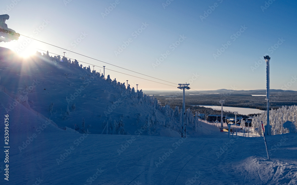 Kuusamo / Finland: Magnificent view from Saarua top downhill to Ruka Village on a beautiful day in February
