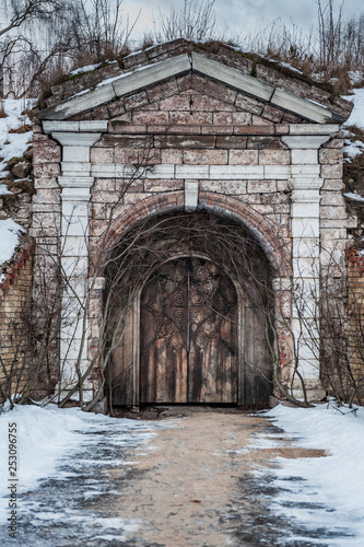 Old wooden door of Daugavgrivas fortress,  Latvia. Main entrance. photo