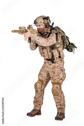 Special forces soldier with rifle on white background. army, military and people concept
