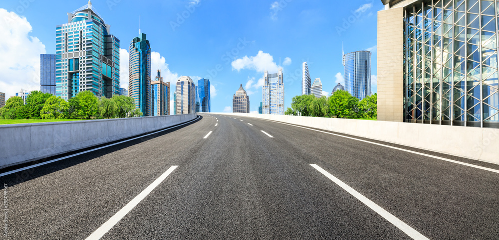 Asphalt road and modern city commercial building scenery in Shanghai Asphalt road and modern city commercial building scenery in Shanghai