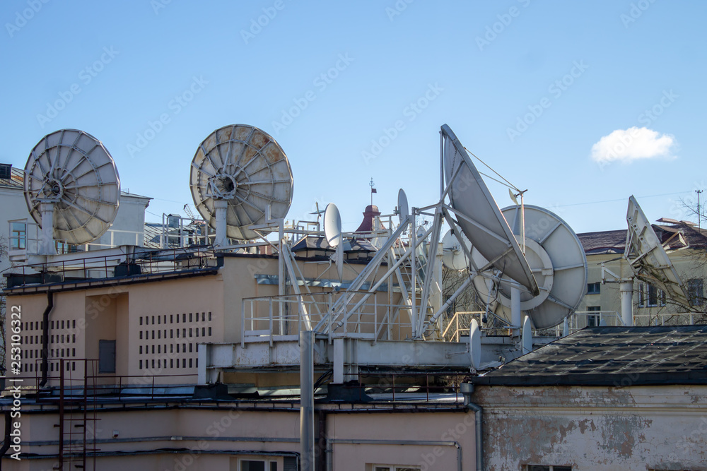 Satellite dishes installed on the roofs of houses, Internet and communication, city TV