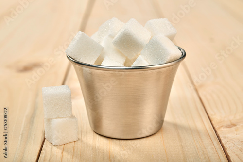 sugar cubes on a wooden table