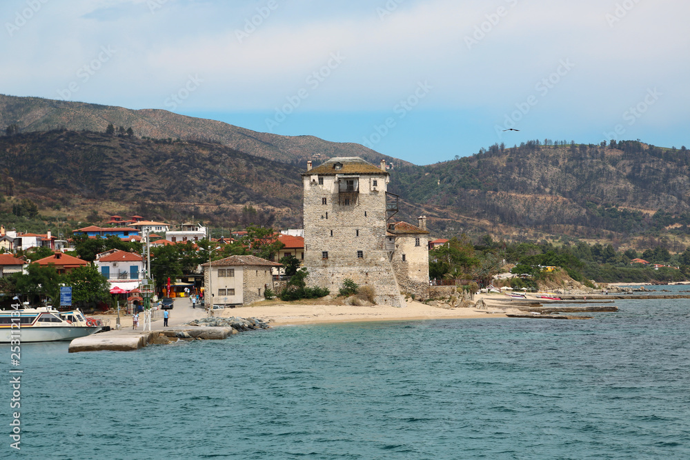 Old tower at the beach in Ouranoupoli, Athos peninsula, Chalkidiki, Greece
