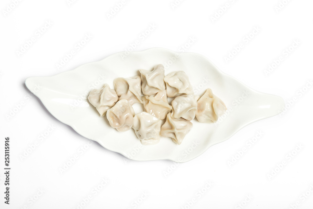 a plate of dumpling on white background. a plate of dumpling on white background.