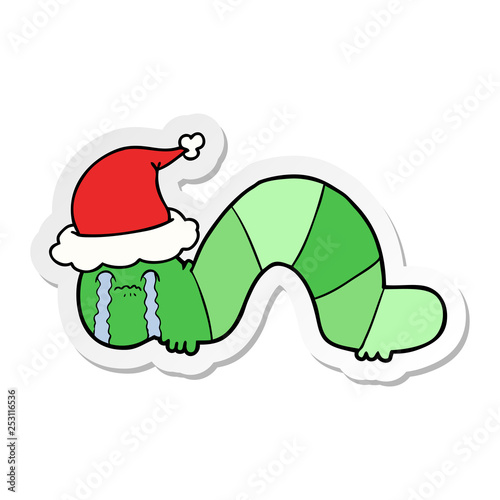 sticker cartoon of a caterpillar obsessing over his regrets wearing santa hat