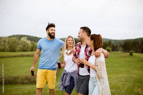 Happy group of friends havi...