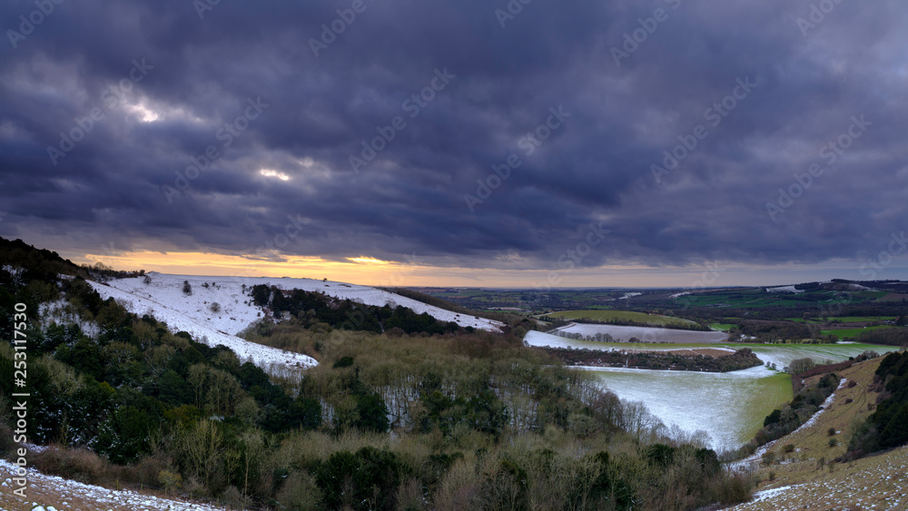 Snowy vsunsetacross the Meon Valley towards Old Winchester Hill, South Downs National Park, Hampshire, UK