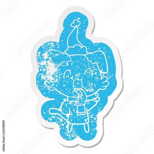 cartoon distressed sticker of a panting dog wearing santa hat