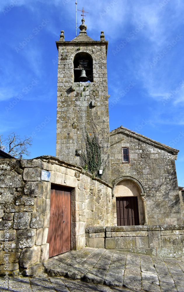 Romanesque medieval San Esteban Church. Facade, bell tower and arched door. Allariz, Orense, Spain.