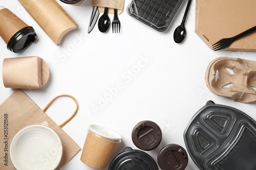 Frame of different takeout containers and space for text on white background, top view. Food delivery service photo