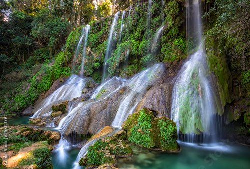 El Nicho Waterfalls in Cuba. El Nicho is located inside the Gran Parque Natural Topes de Collantes a forested park that extends across the Sierra Escambray mountain range in central Cuba. photo