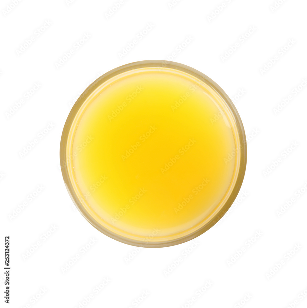 Glass of orange juice on white background, top view