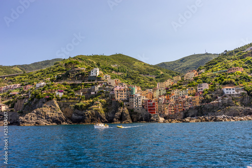 The cityscape of Riomaggiore viewed from the sea, Cinque Terre, Italy, Riviera © SkandaRamana