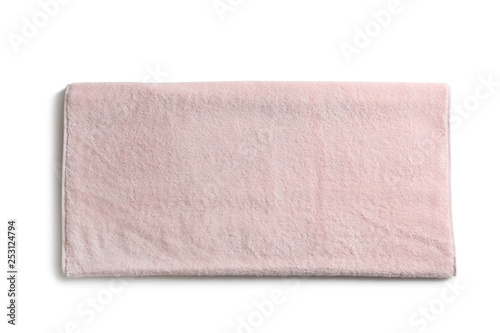 Folded soft terry towel on white background, top view