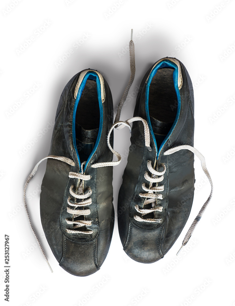 Old football shoes isolated on white