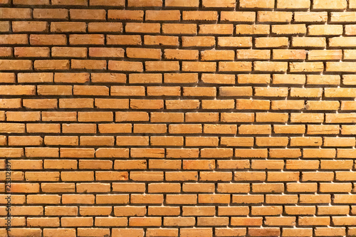 orange grunge brick wall background texture at thailand