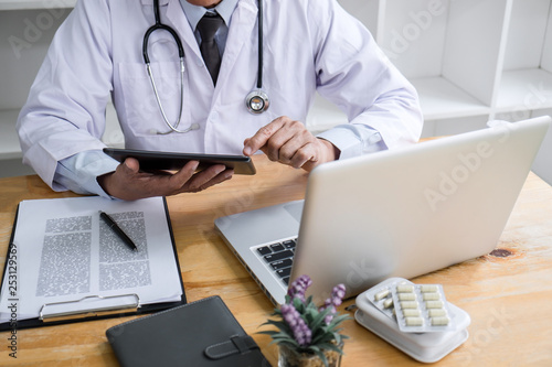 Health care and Medical concept  doctor checking patient history form while think about finding a cure for a diagnosis  treatment methods to rehabilitate the body recommend treat of patient