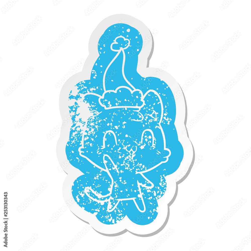 cartoon distressed sticker of a happy cat wearing santa hat cartoon distressed sticker of a happy cat wearing santa hat