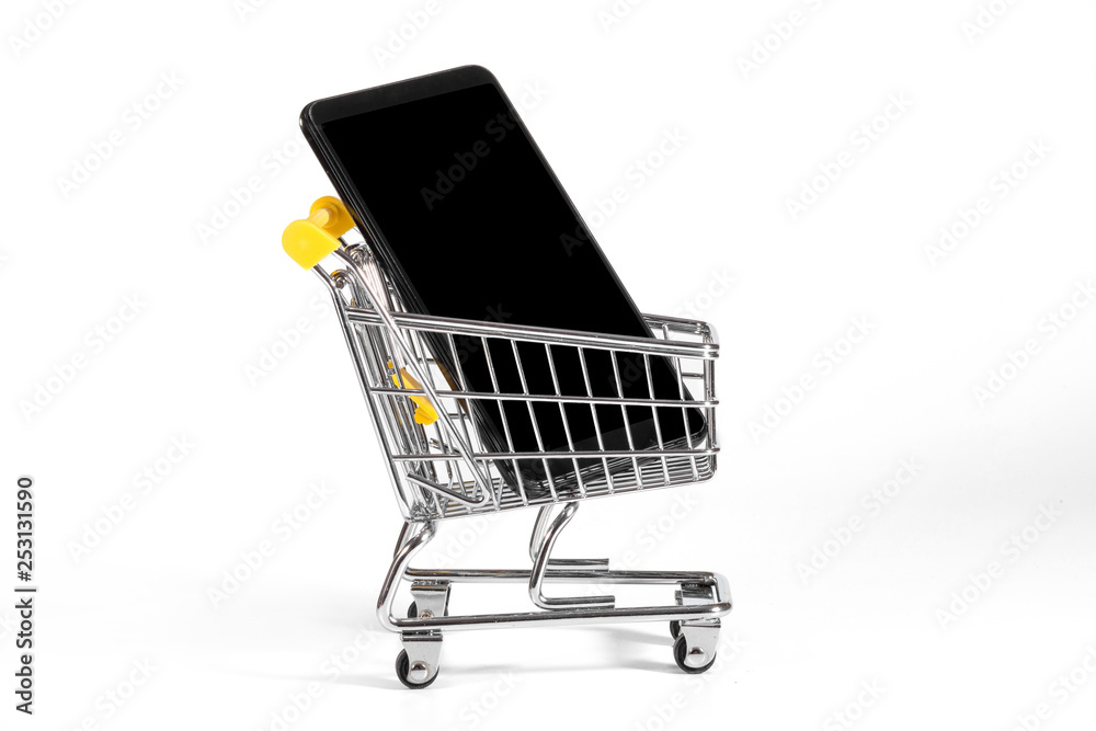 A cellphone in a shopping cart at the white background.