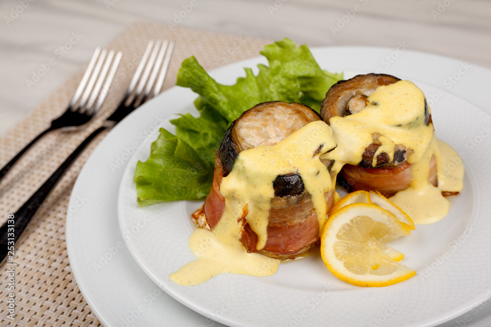 Eggplant and bacon rolls with cheese, lemon and green salad.