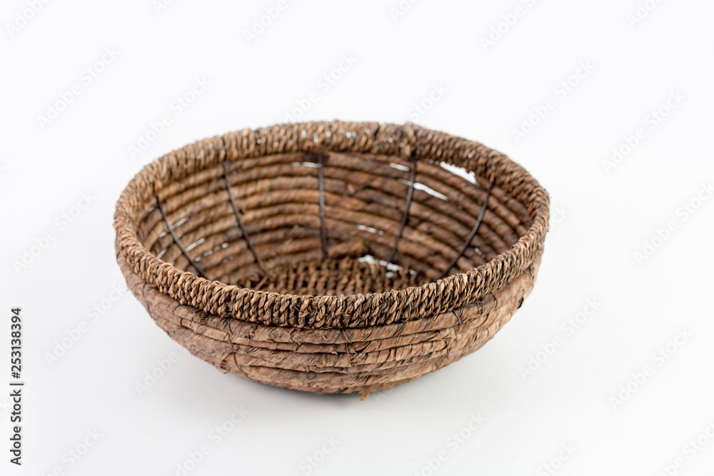 Fototapeta premium empty wicker basket isolated on white background