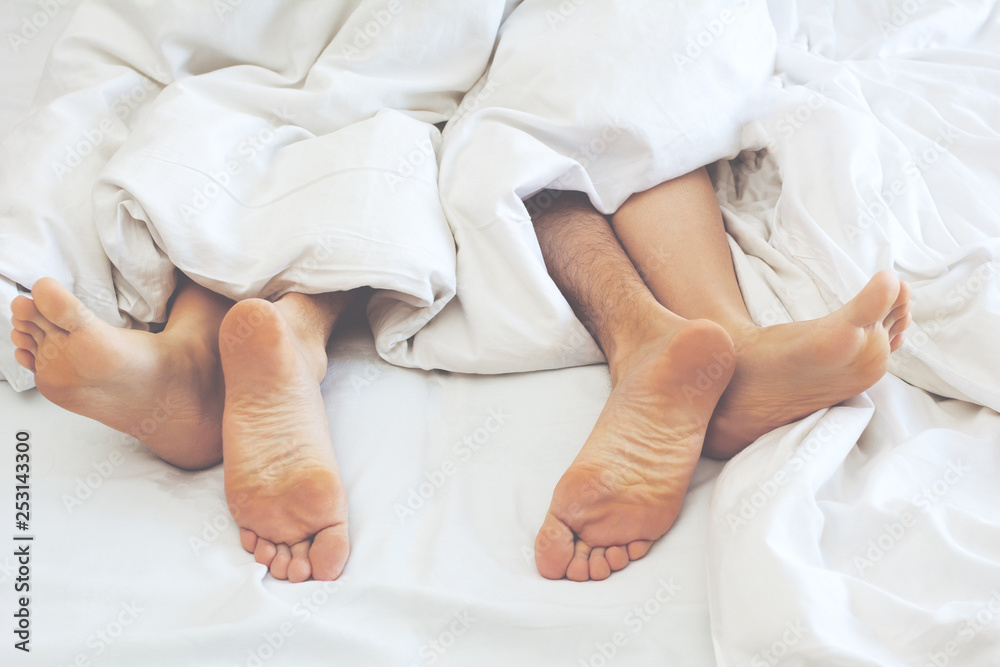 1000px x 667px - Young couple making sex under blanket in bedroom. Sleeping spouses in their bed. Stock Photo | Adobe Stock