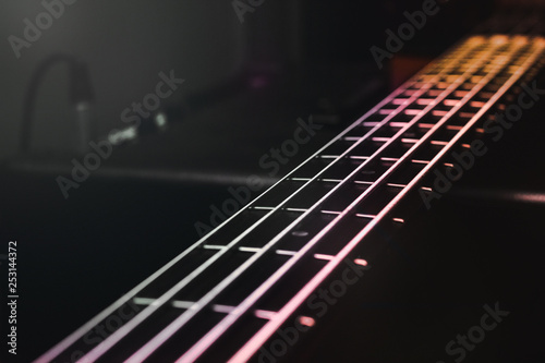 Fotografie Close-up view on bass guitar strings and frets