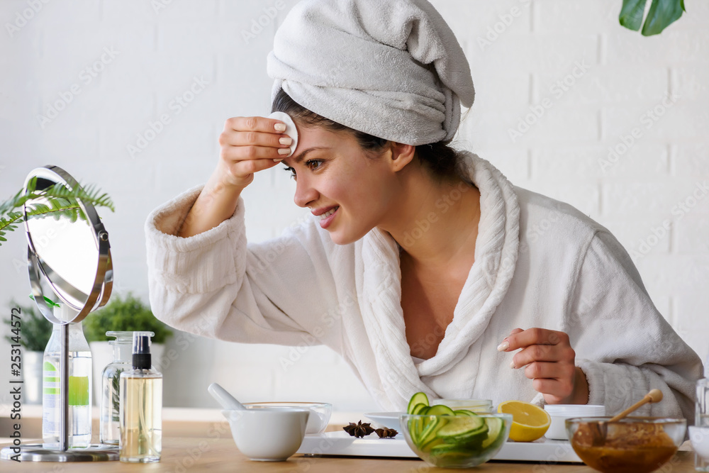 Young woman cleaning face with natural cosmetics. Clean fresh skin care. Young woman cleaning face with natural cosmetics. Clean fresh skin care.