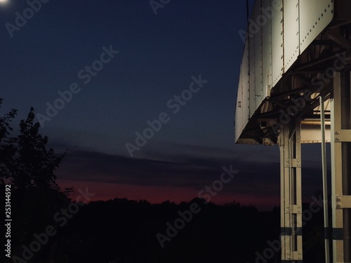 Pink Sky at Dusk Over Train Platform – Serene Urban Sunset Scene