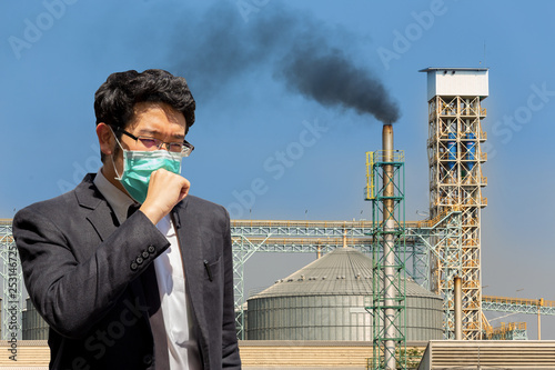 A man wearing mouth mask against air smog pollution with PM 2.5.